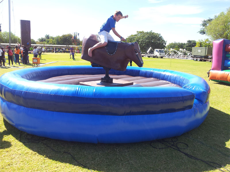 Kids riding on the mechanical bull