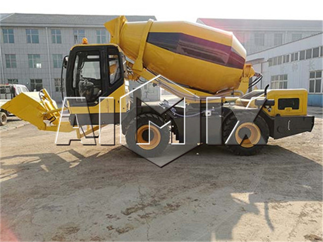 Self loading concrete mixer